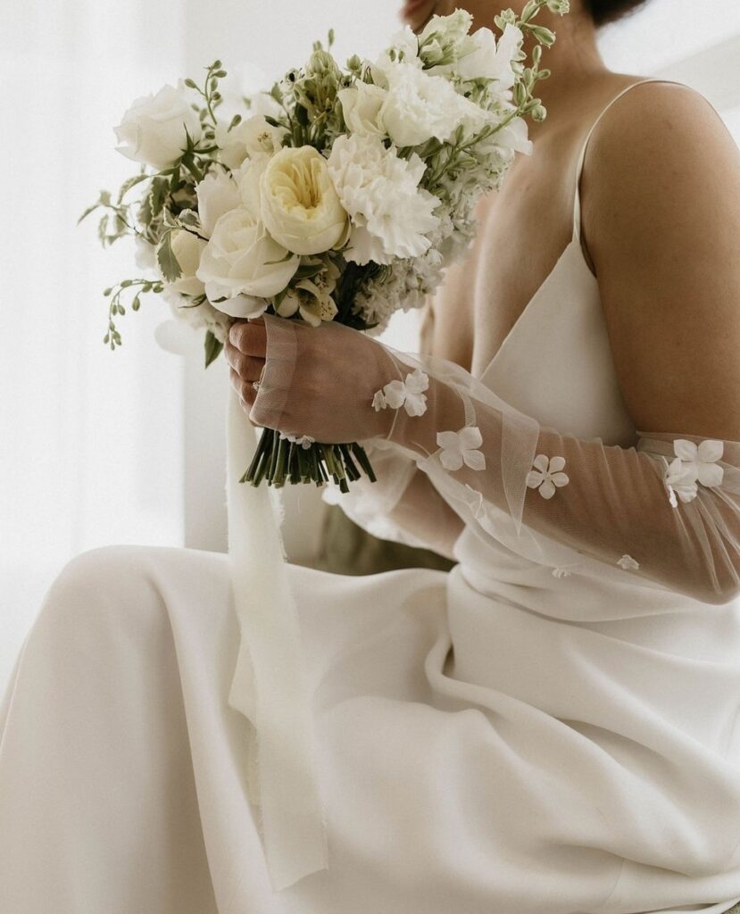 Bridal gloves are a fun and contemporary way to add some delicate detail to a minimalist dress | Wedding Dress Near Me
