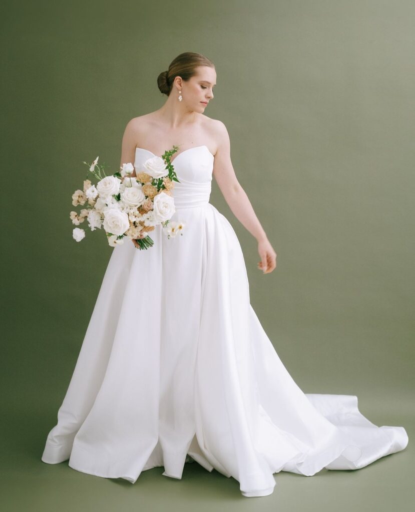 The absolute joy when photographer Emma Pilkington rolls out a Feathers & Florence green backdrop! | Wedding Dress Preston