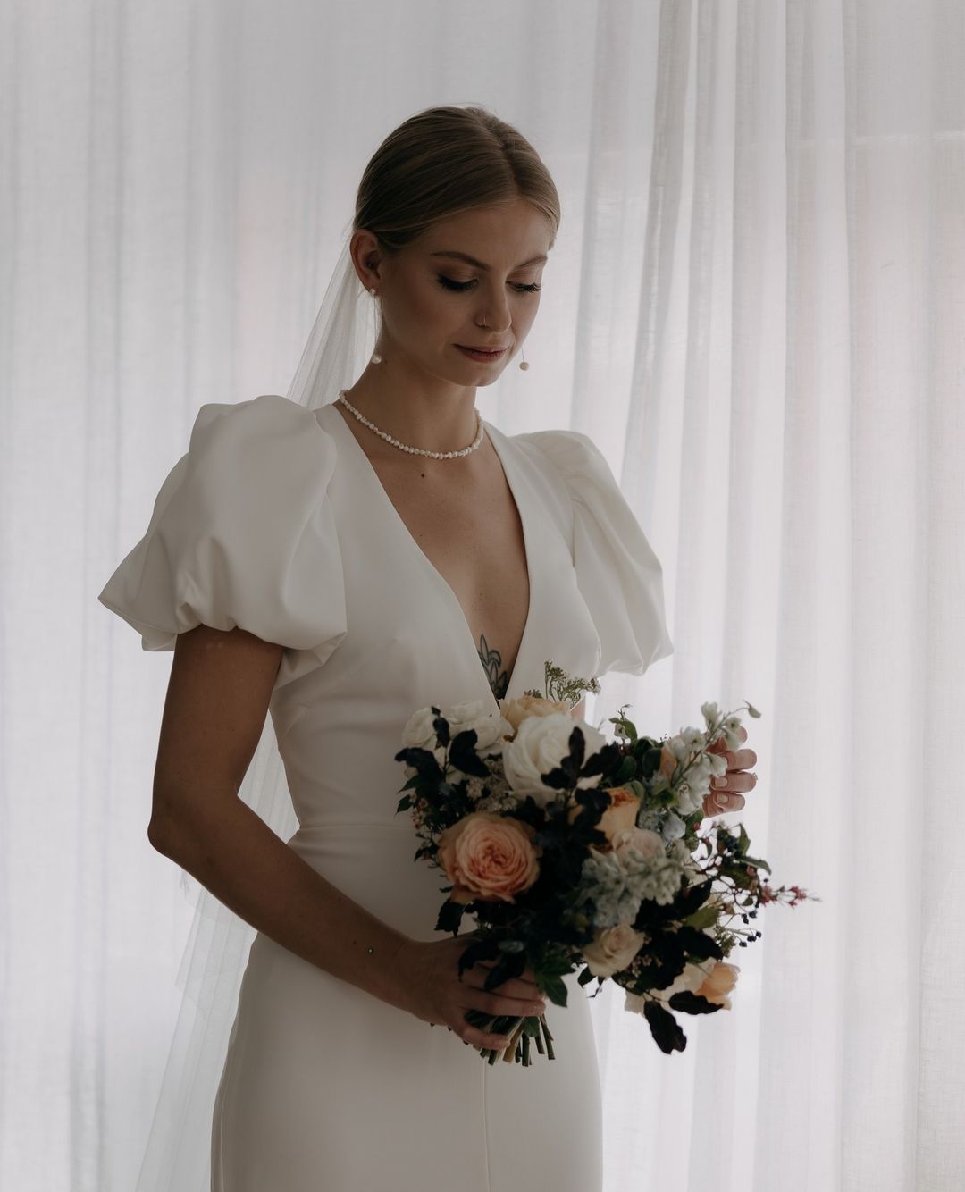 The Luna by Edwina O'Gorman wedding dress embodies elegance with a daring twist | Feathers & Florence | Wedding Dress Preston