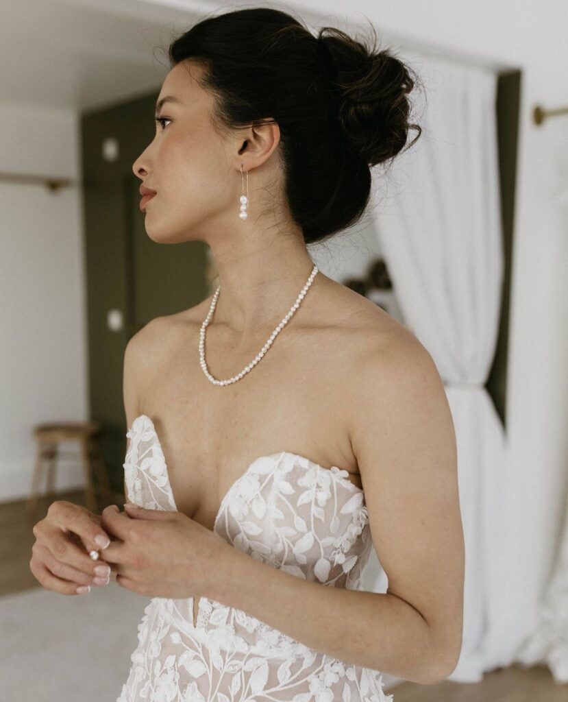 The delicate dance of feminine leaf embroidery and 3D florals brings romance to life | Feathers & Florence | Wedding Dress Preston