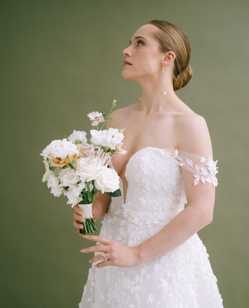 Introducing Carla by House of Savin London. ⁠An A Line wedding dress with petite floral details | Feathers & Florence | Wedding Dress Preston